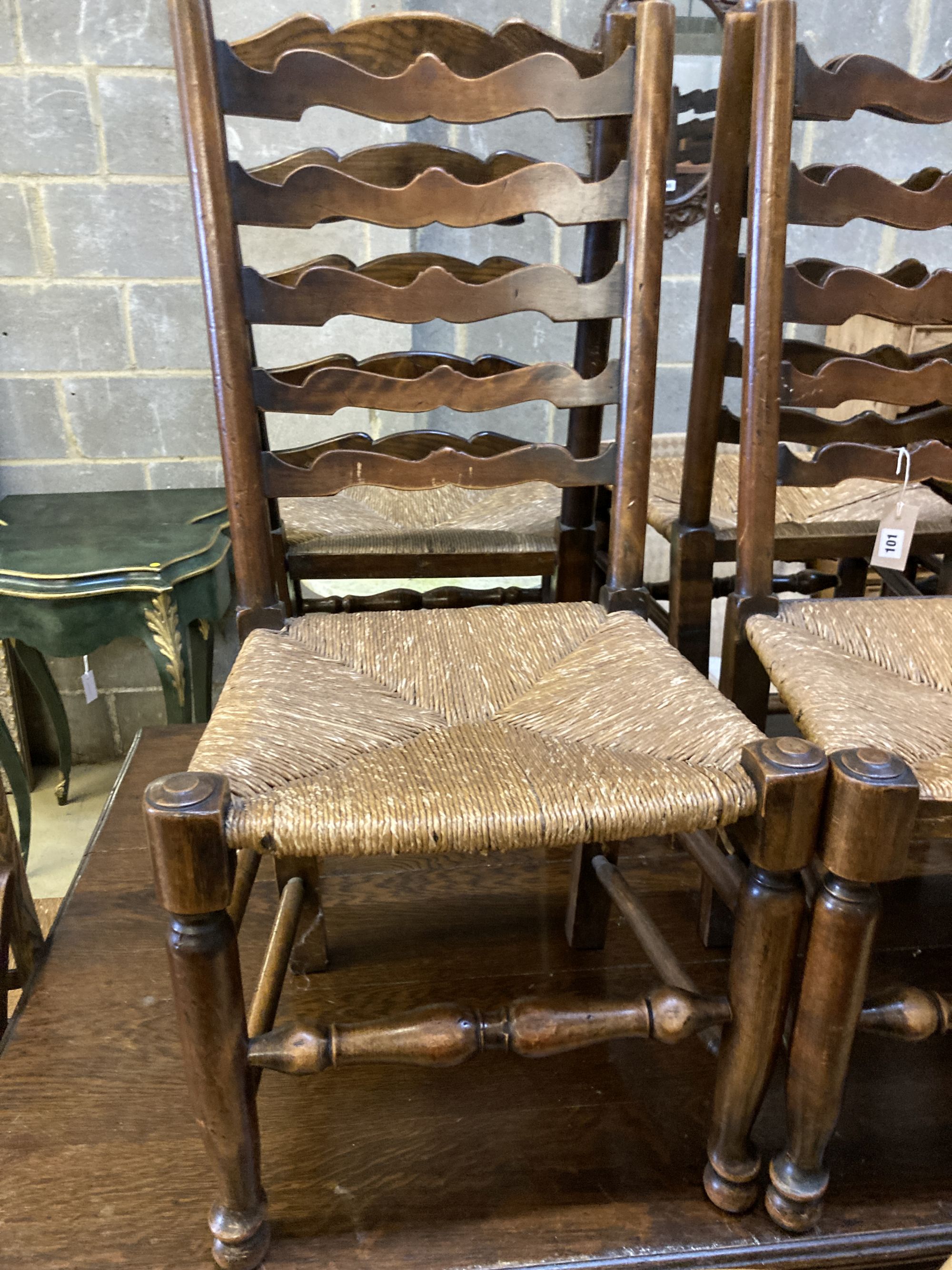 A harlequin set of nine early 19th century ash rush seated ladderback dining chairs (5 and 4)